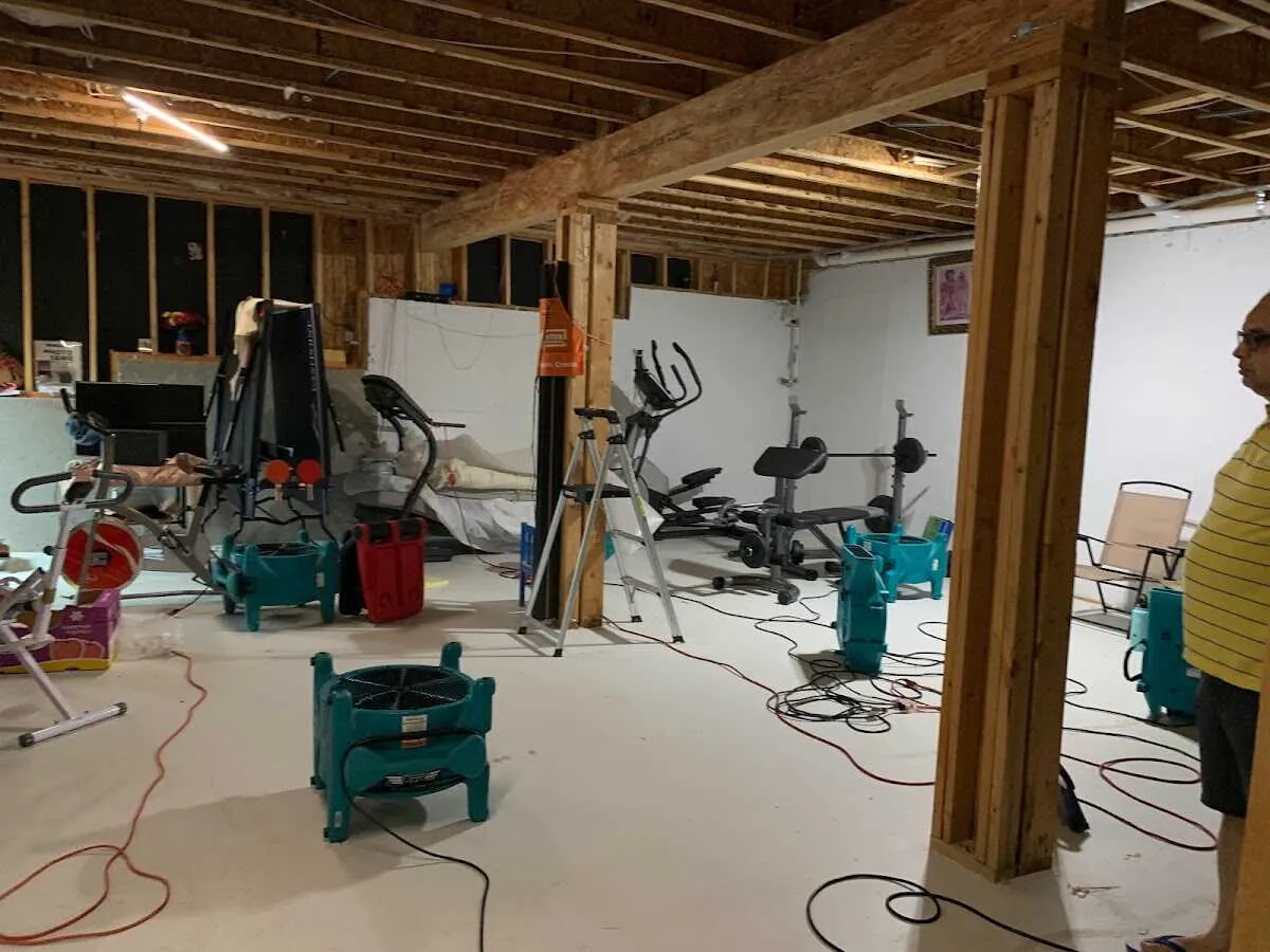Basement drying equipment setup for Contents Cleaning & Restoration in Logan